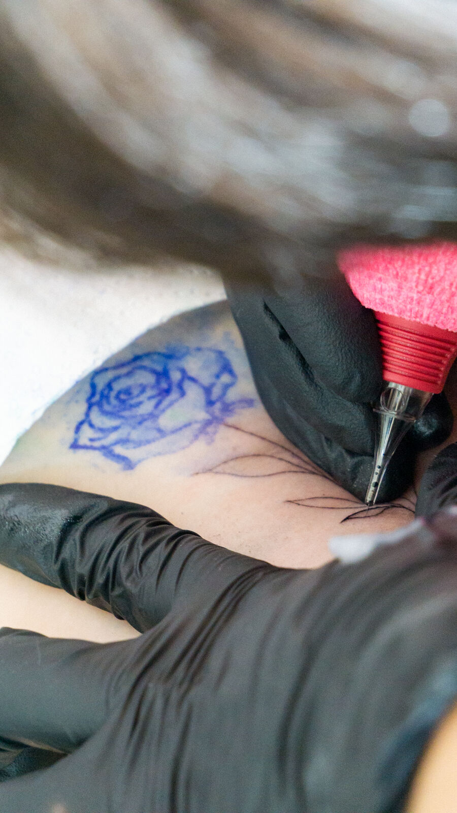 Paula tattooing in the studio