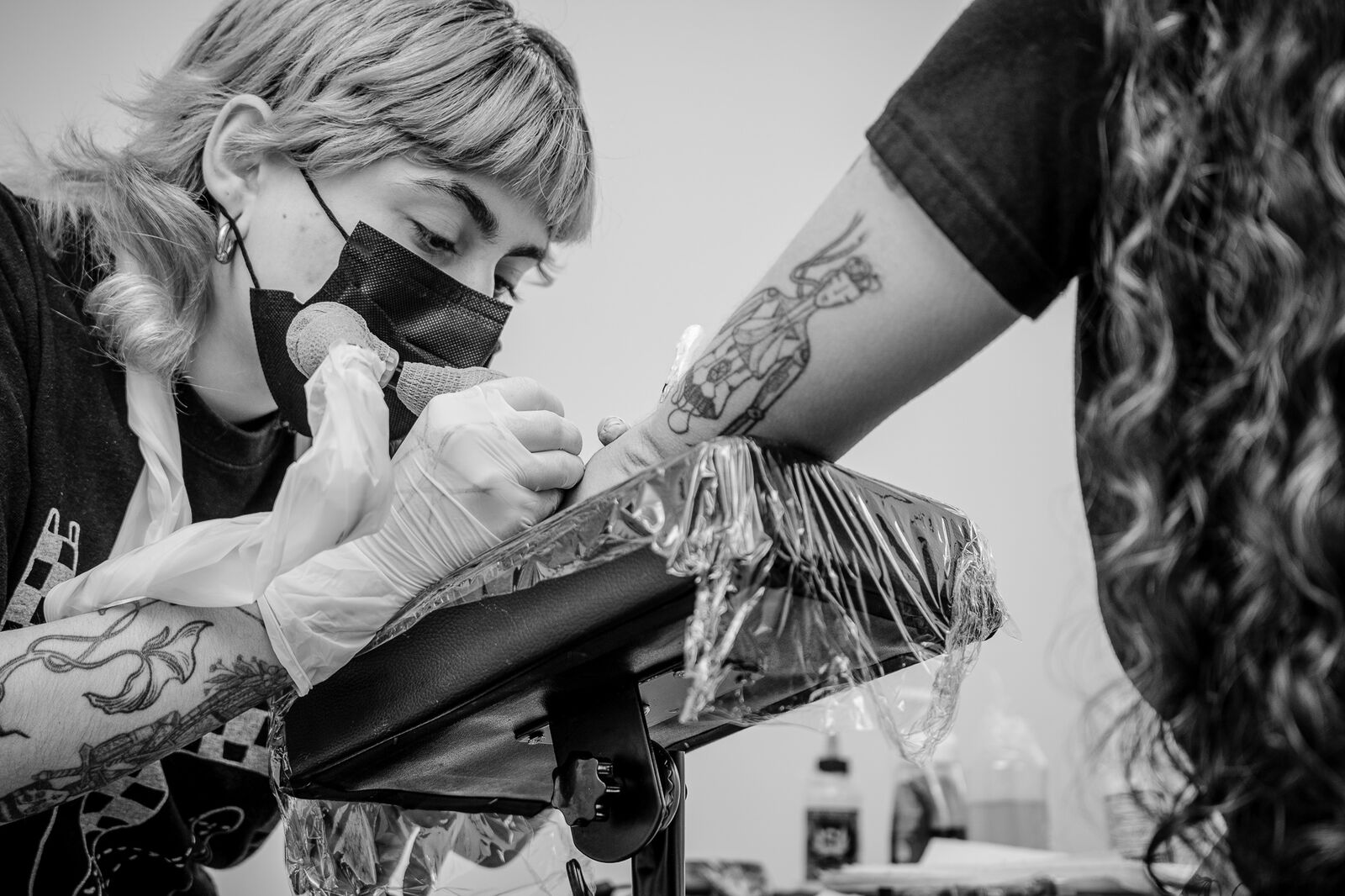 Paula tattooing in the studio